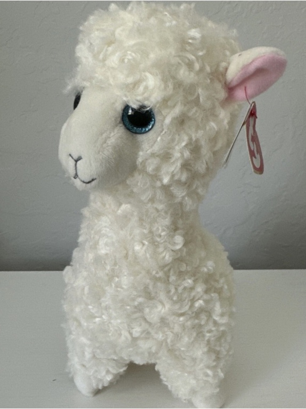 Ty Cream Curly Alpaca Plush with Blue Eyes and Pink Ears